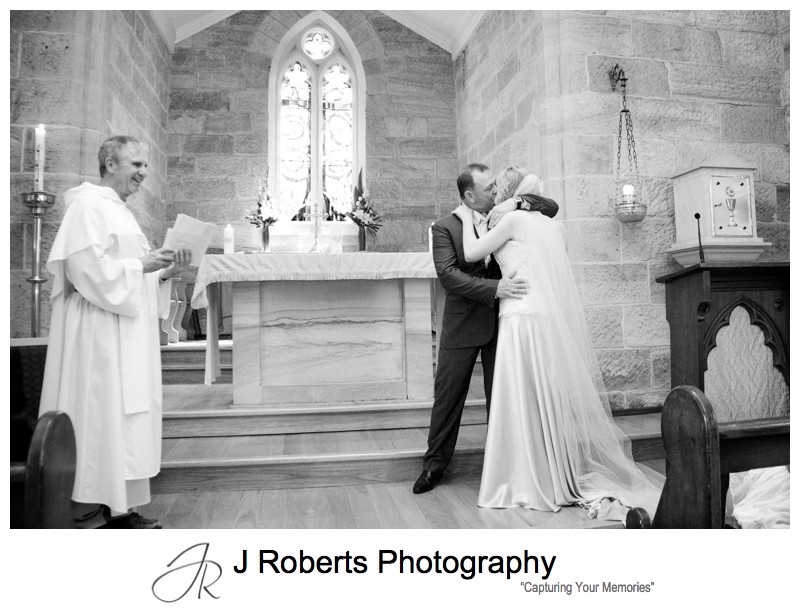 Couples first kiss at St Bedes Pyrmontb - wedding photography sydney